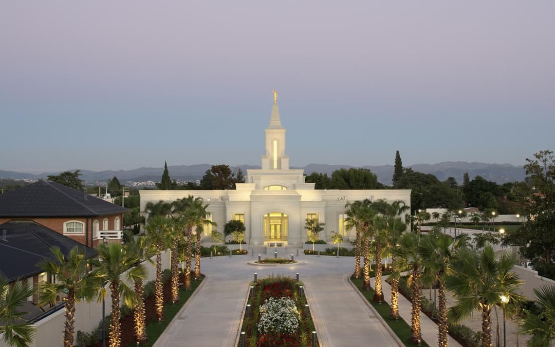 Elevated front view of the Córdoba Argentina Temple at twilight.