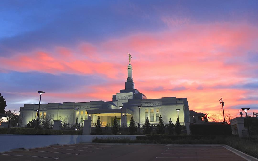 Perth Australia Temple exterior at sunset with Moroni statue.
