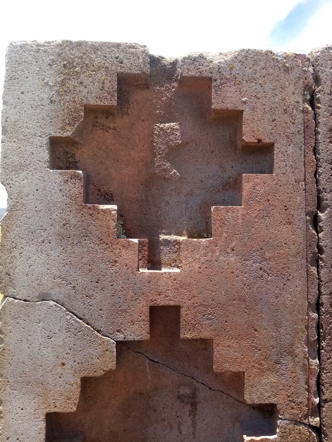 Carved stepped cross motif on a megalithic stone block at Tiwanaku.