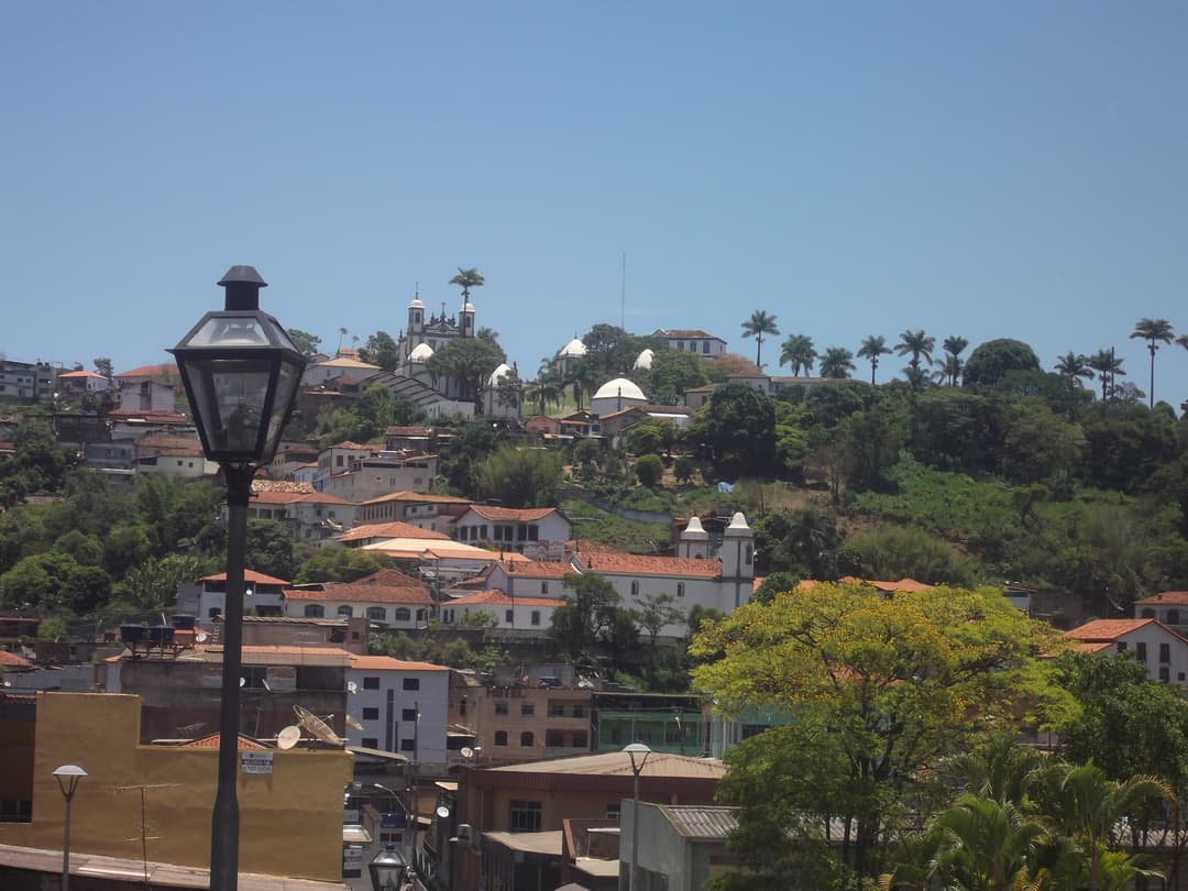 Distant view of the sanctuary complex rising above the town of Congonhas.