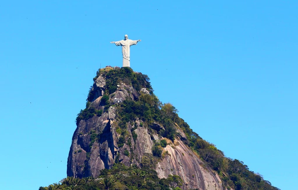 Christ the Redeemer atop Corcovado mountain under a clear blue sky