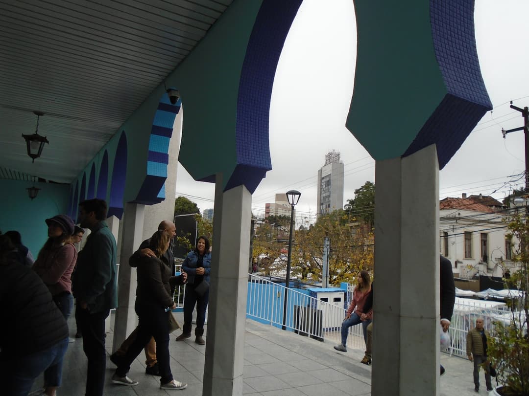 Walkway under blue Moorish arches at Mesquita Brasil, São Paulo.