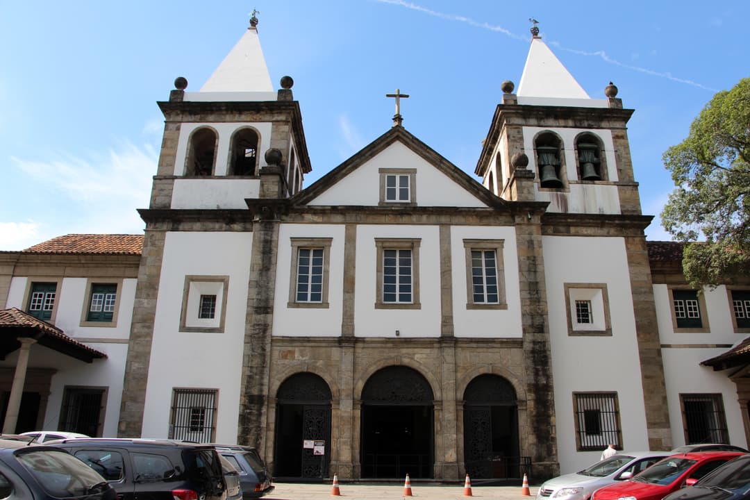 Frontal exterior view of the monastery's main facade and twin spires.