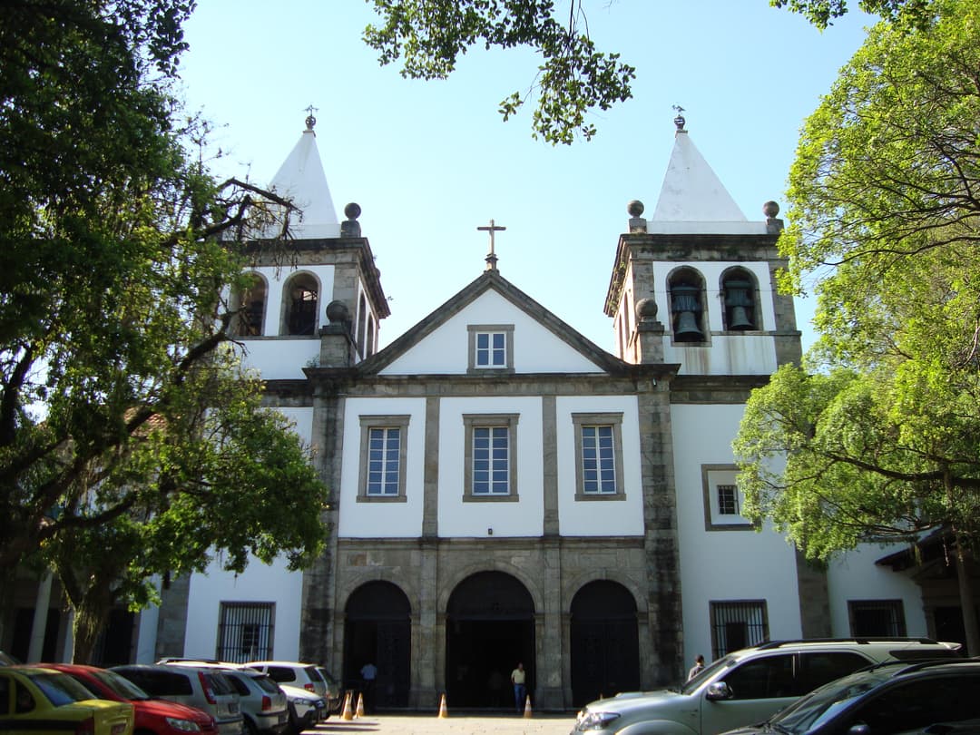 Front exterior view of the monastery facade with twin spires.
