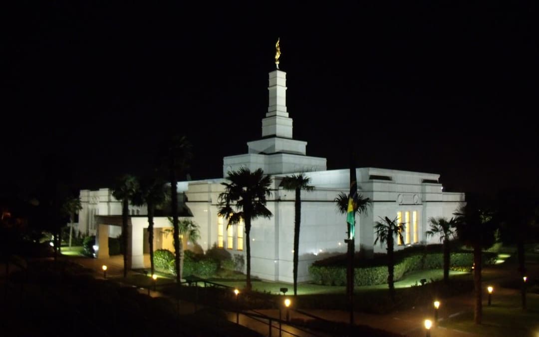 Exterior view of the Porto Alegre Brazil Temple illuminated at night.
