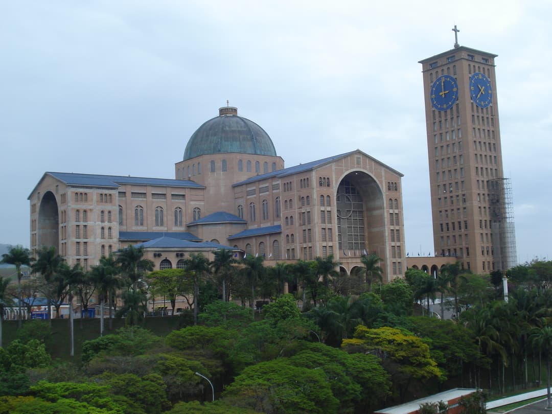 Exterior view of the basilica showing its central dome and clock tower.