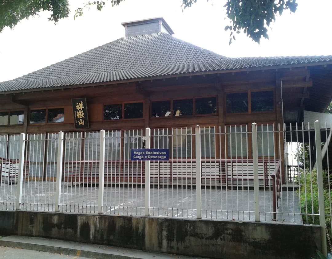 Front exterior view of the traditional wooden temple building.