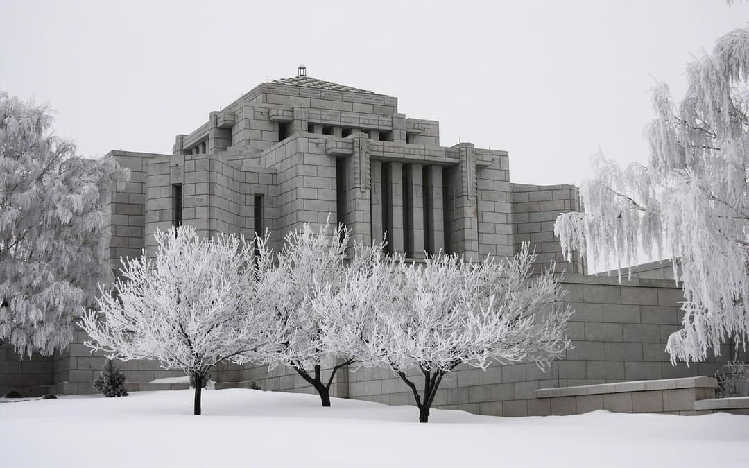Cardston Alberta Temple exterior in winter, frosted trees.