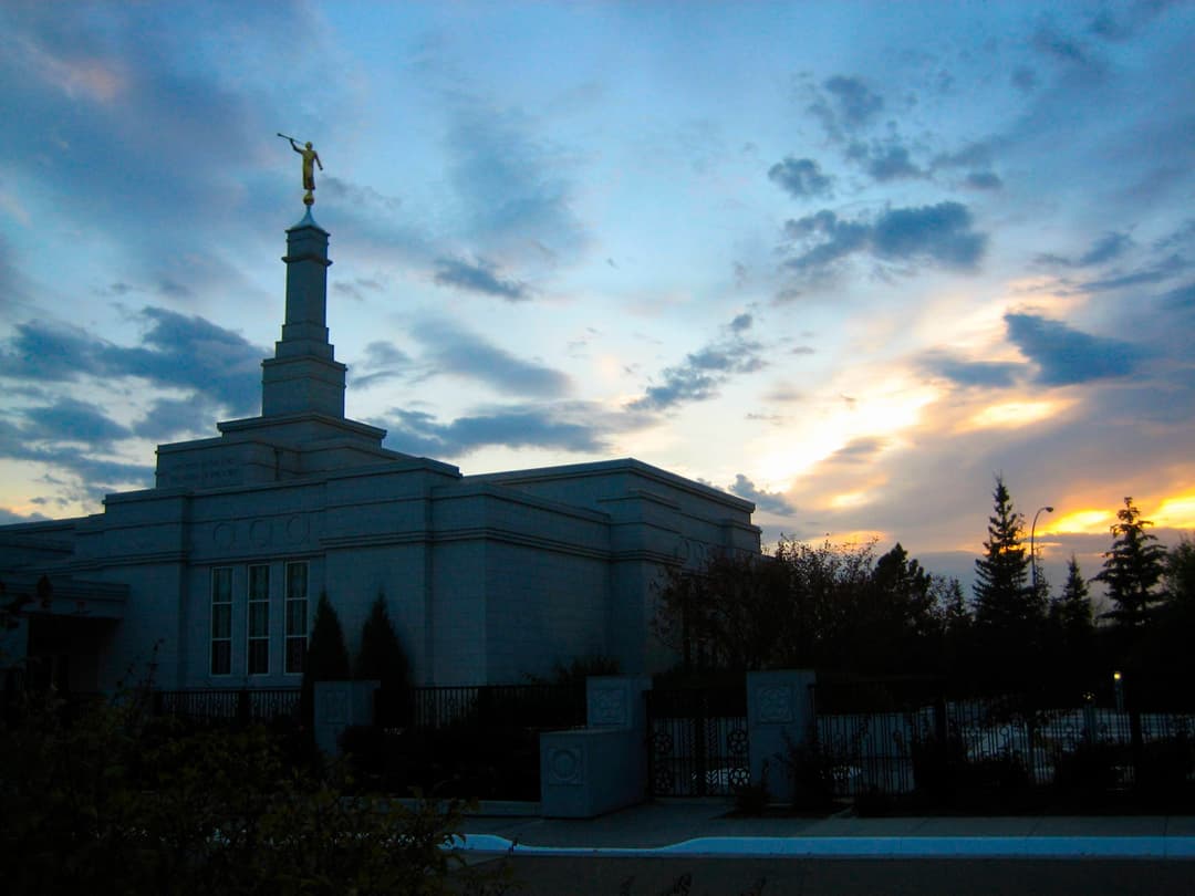 Edmonton Alberta Temple at twilight with Angel Moroni statue.