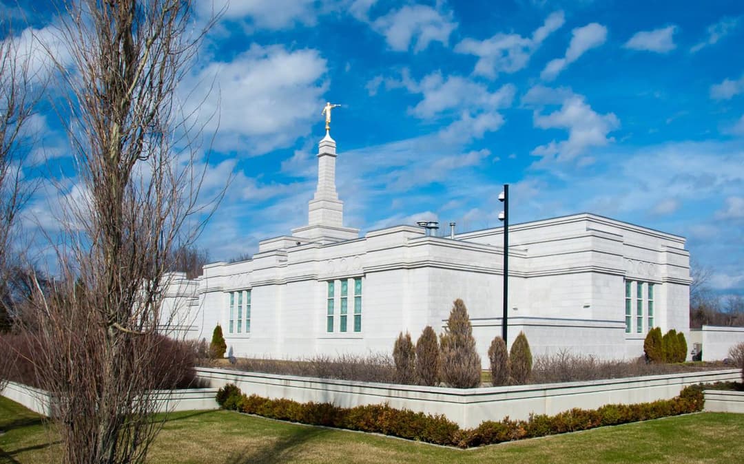 Montreal Quebec Temple exterior, front-side view, spire with Angel Moroni.