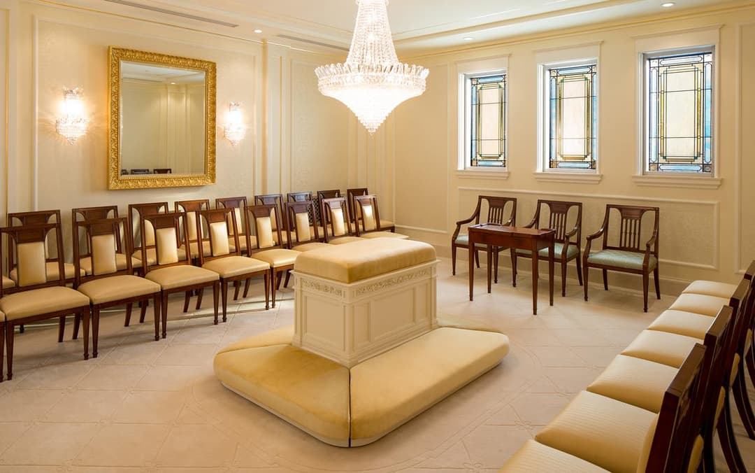 Montreal Quebec Temple sealing room with altar, chandelier, and stained glass.