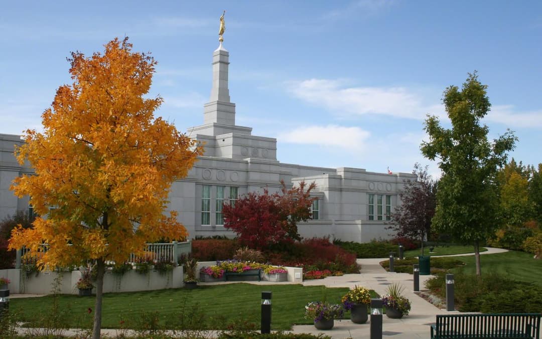 The Regina Saskatchewan Temple framed by colorful autumn foliage.