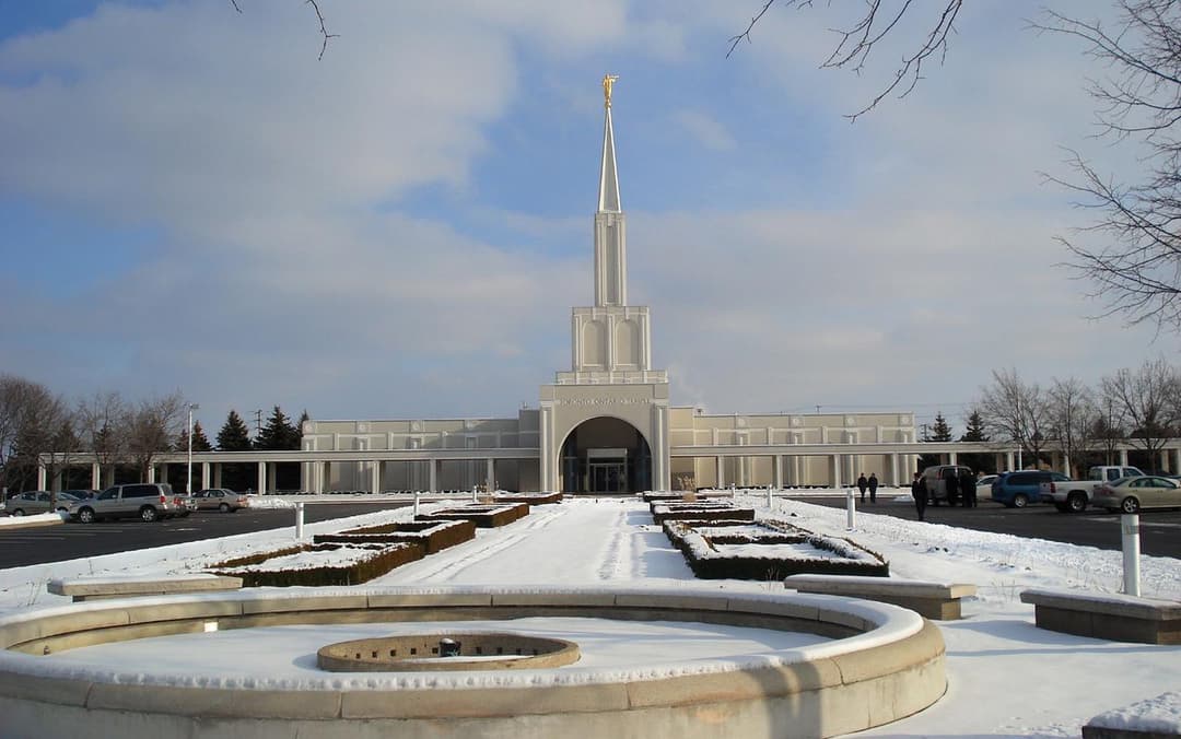 The Toronto Ontario Temple surrounded by lush greenery.