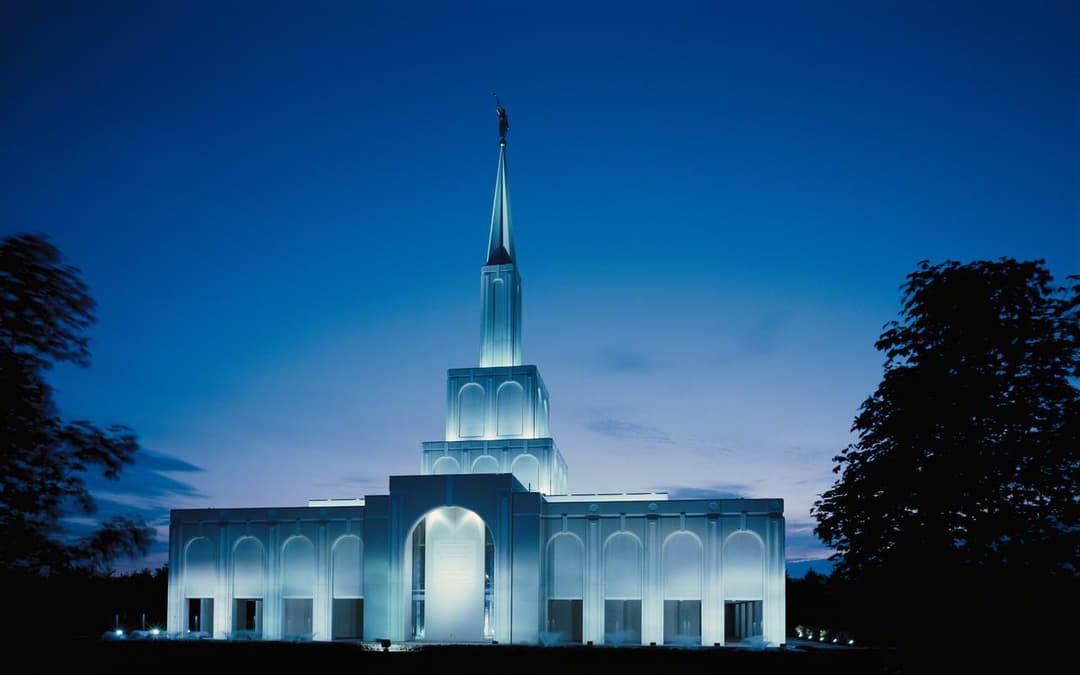 The Toronto Ontario Temple illuminated at night.