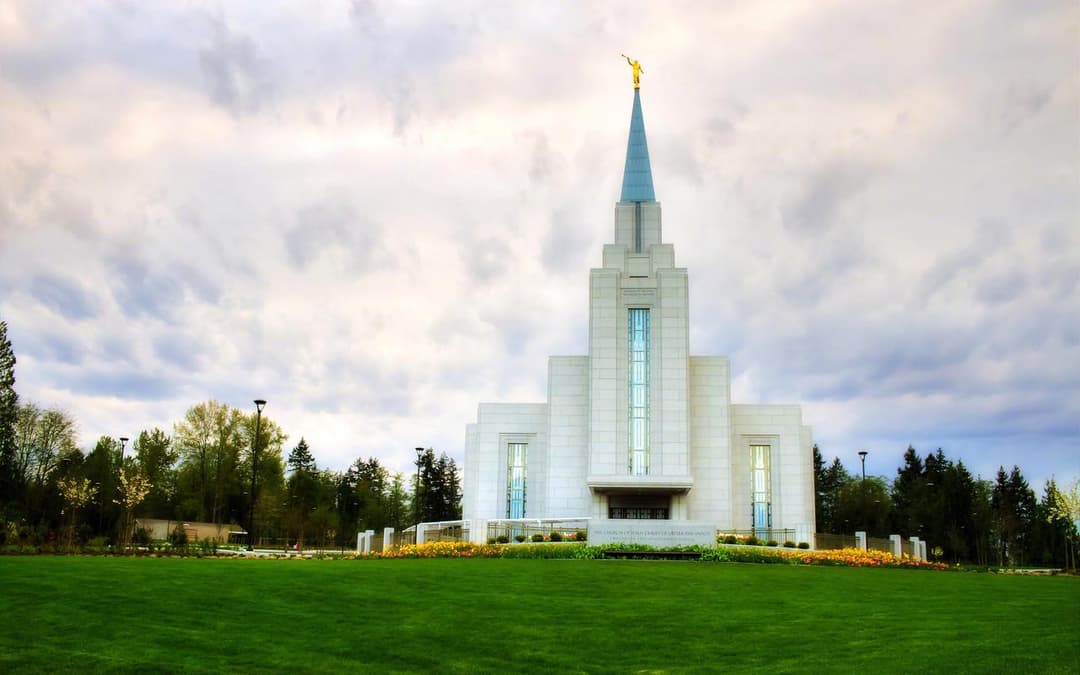 Wide front view of the Vancouver British Columbia Temple and manicured lawn.