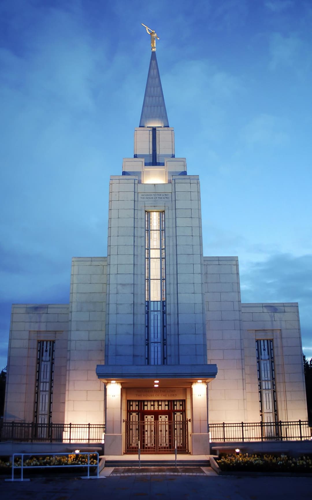 Front entrance and spire of the Vancouver British Columbia Temple at twilight.