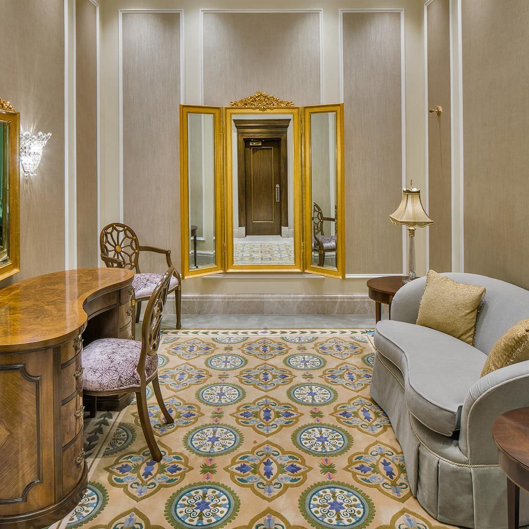 Interior view of the bride's room featuring a vanity desk and ornate mirror.