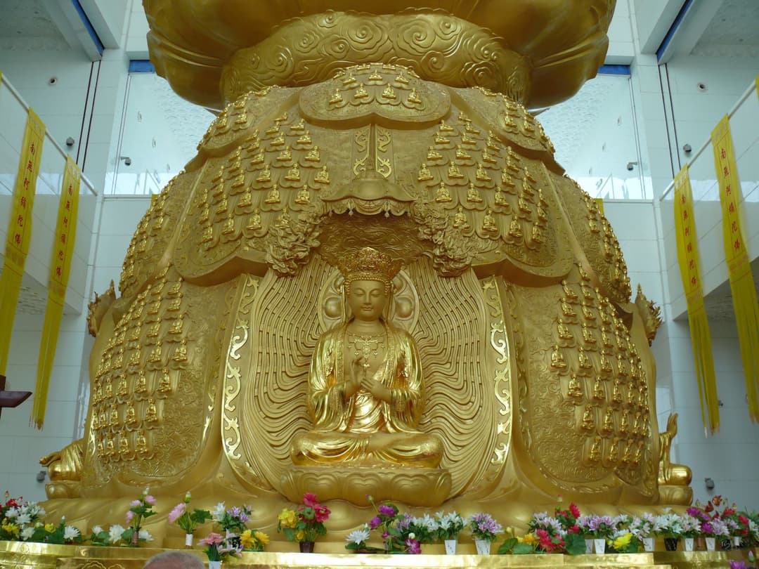 Interior view of a golden Buddha statue and shrine at Famen Temple