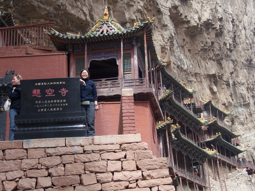 Monument stele and cliffside pavilions at the Hanging Temple
