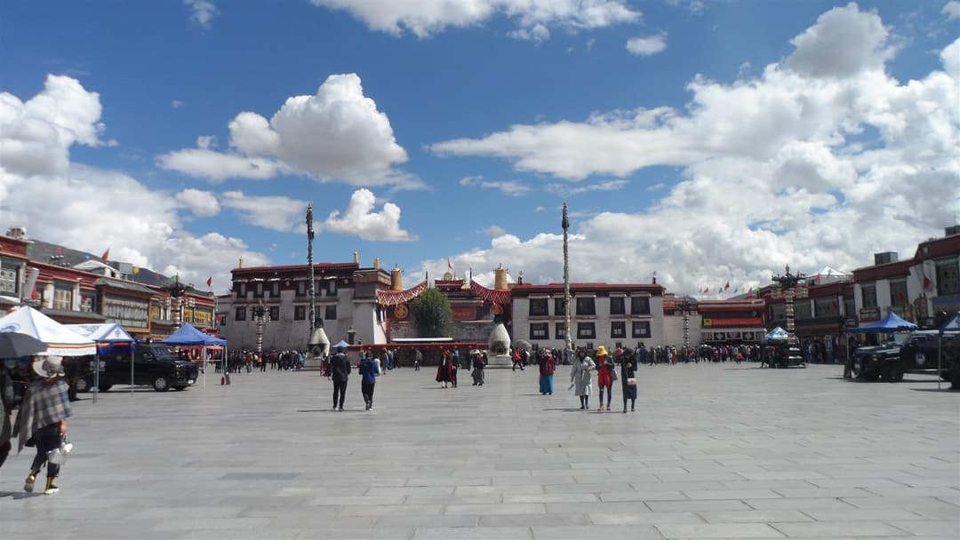 Wide-angle view across Barkhor Square toward Jokhang Temple in Lhasa