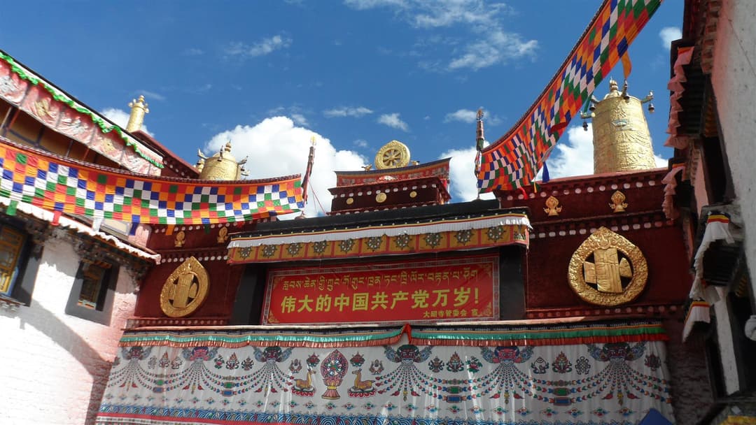Decorated courtyard facade and golden roof ornaments of Jokhang Temple