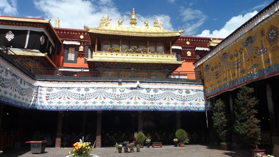 Inner courtyard of Jokhang Temple with ornate golden roof pavilion