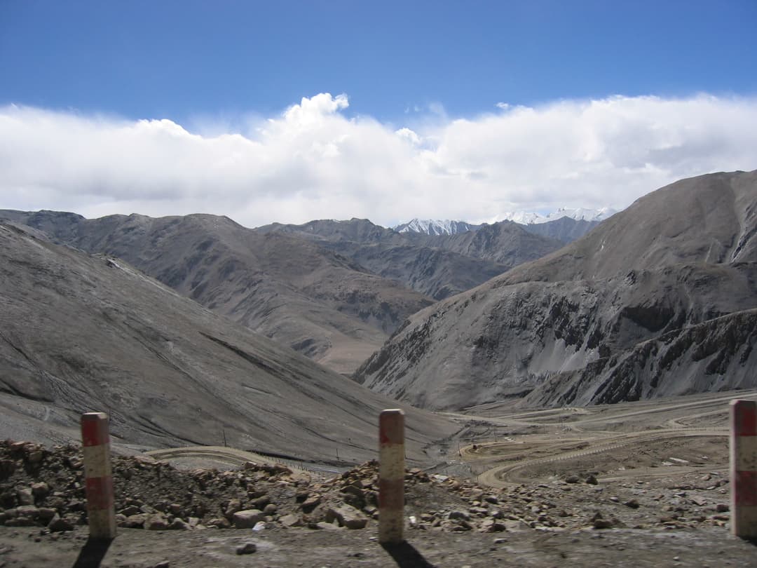 Wide view of winding pass road and arid peaks in the Kunlun Mountains