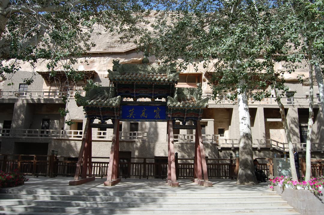 Front view of the wooden entrance archway at the Mogao Caves.