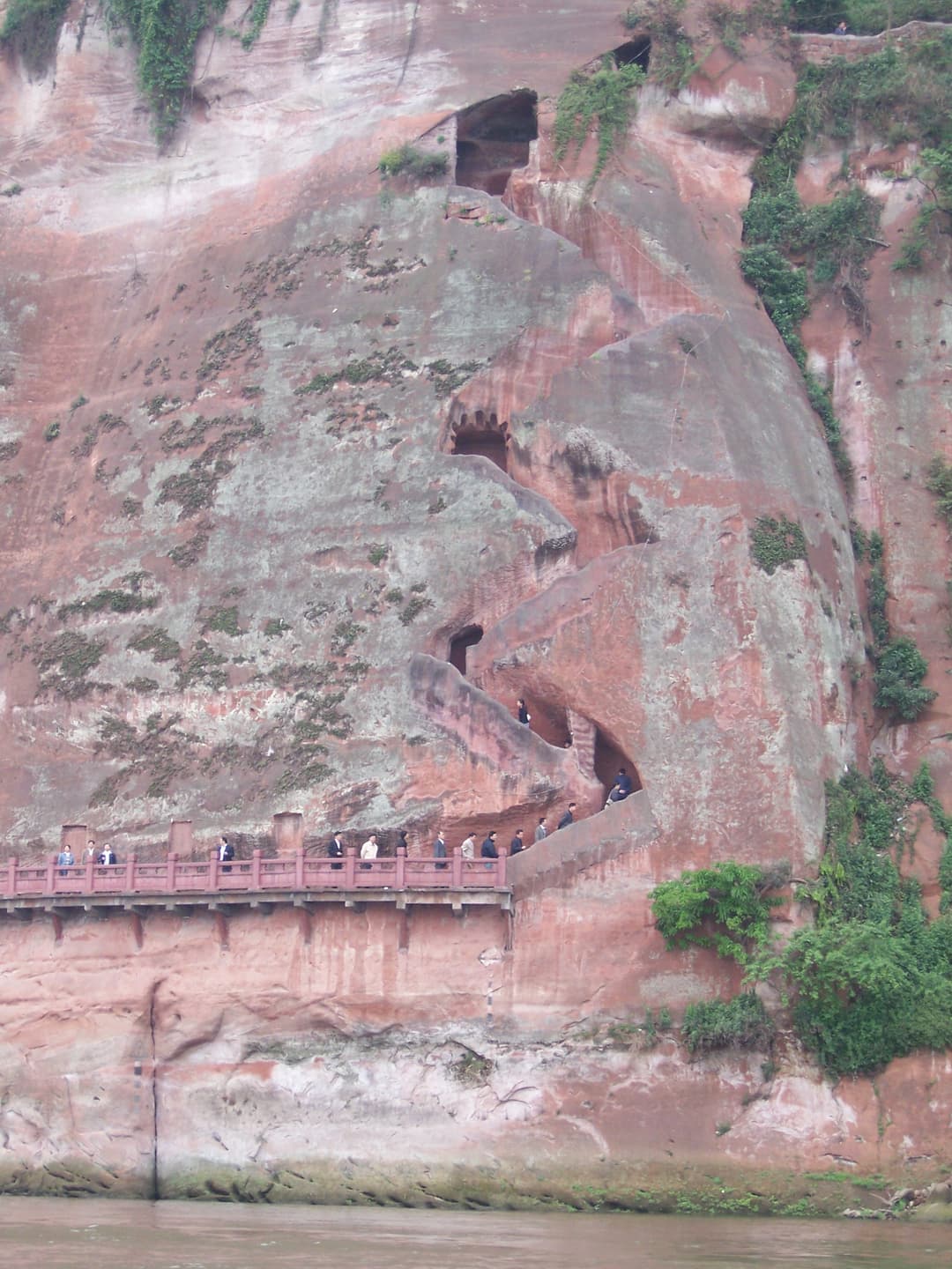 Exterior view of the carved Nine-Bending Plank Road along the red cliff.
