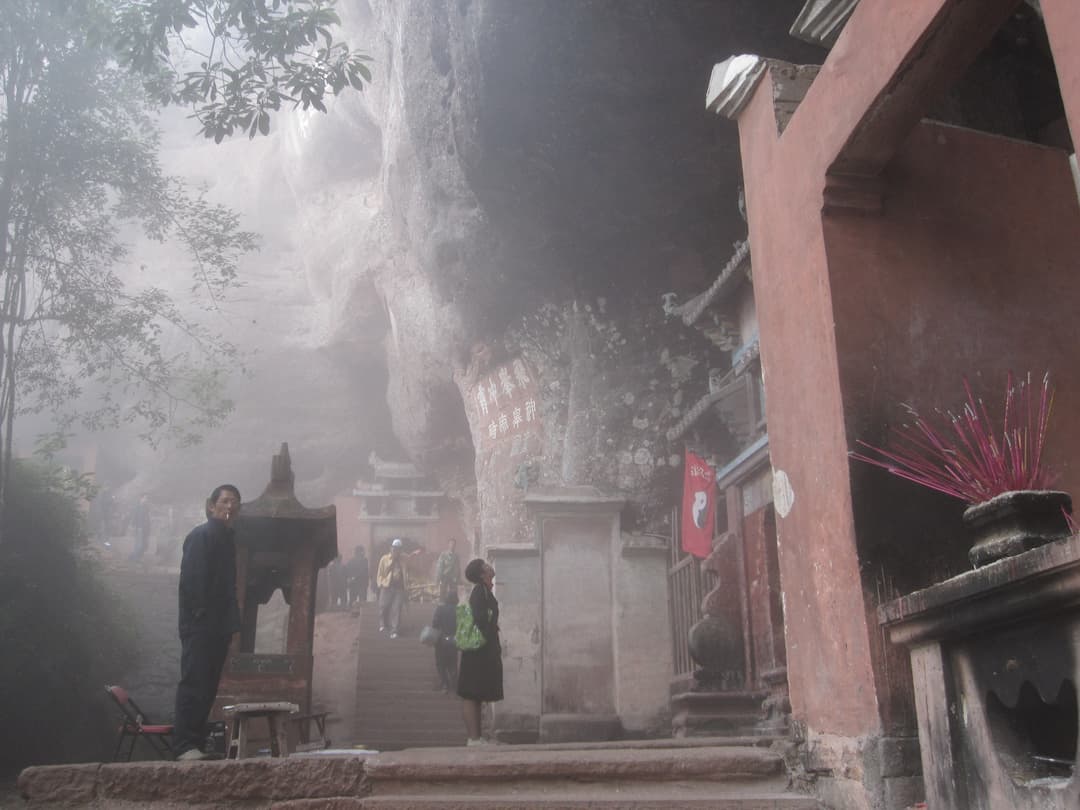A Taoist temple nestled among the cliffs.