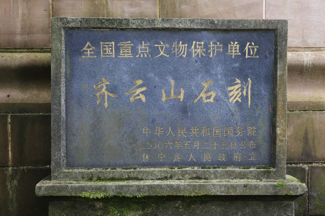 A Taoist monk walking along a mountain path.