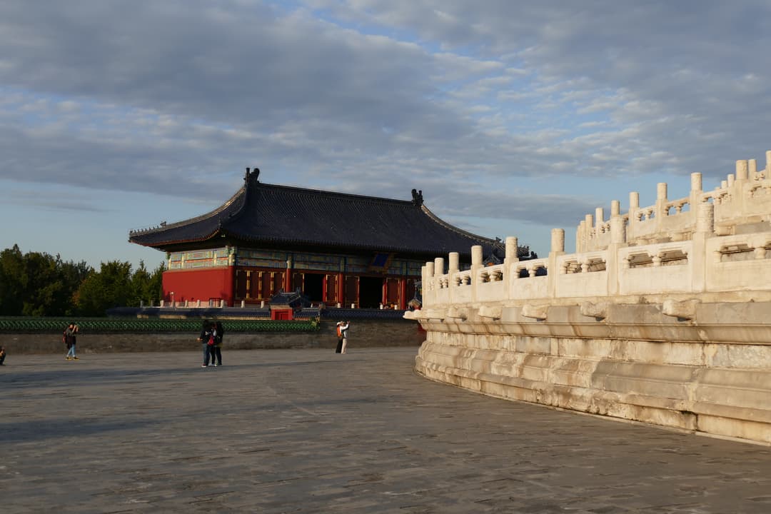 Tiered marble terrace and annex hall in late afternoon light
