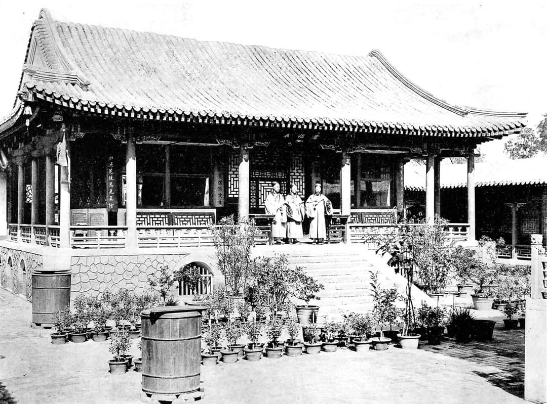 Historic courtyard pavilion with Daoist priests, White Cloud Temple