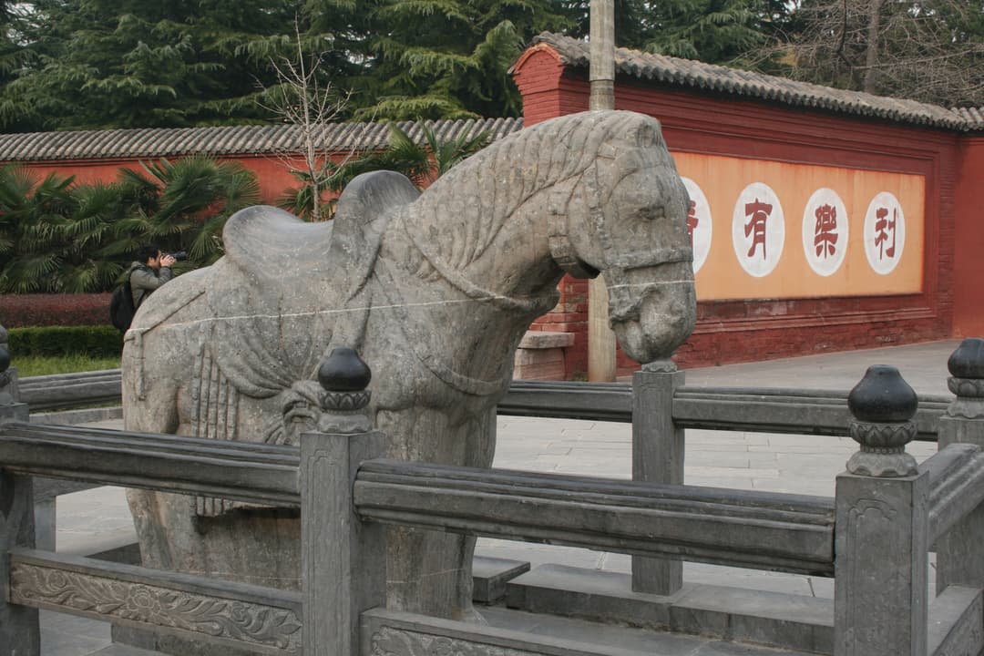 Carved stone horse statue on the grounds of White Horse Temple.