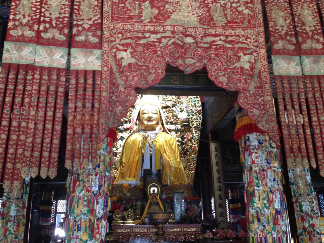 Interior of Falun Hall with golden statue of Je Tsongkhapa