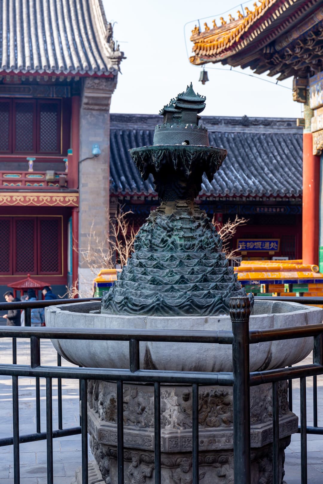 Bronze model of Mount Meru in a stone basin at Yonghe Temple.