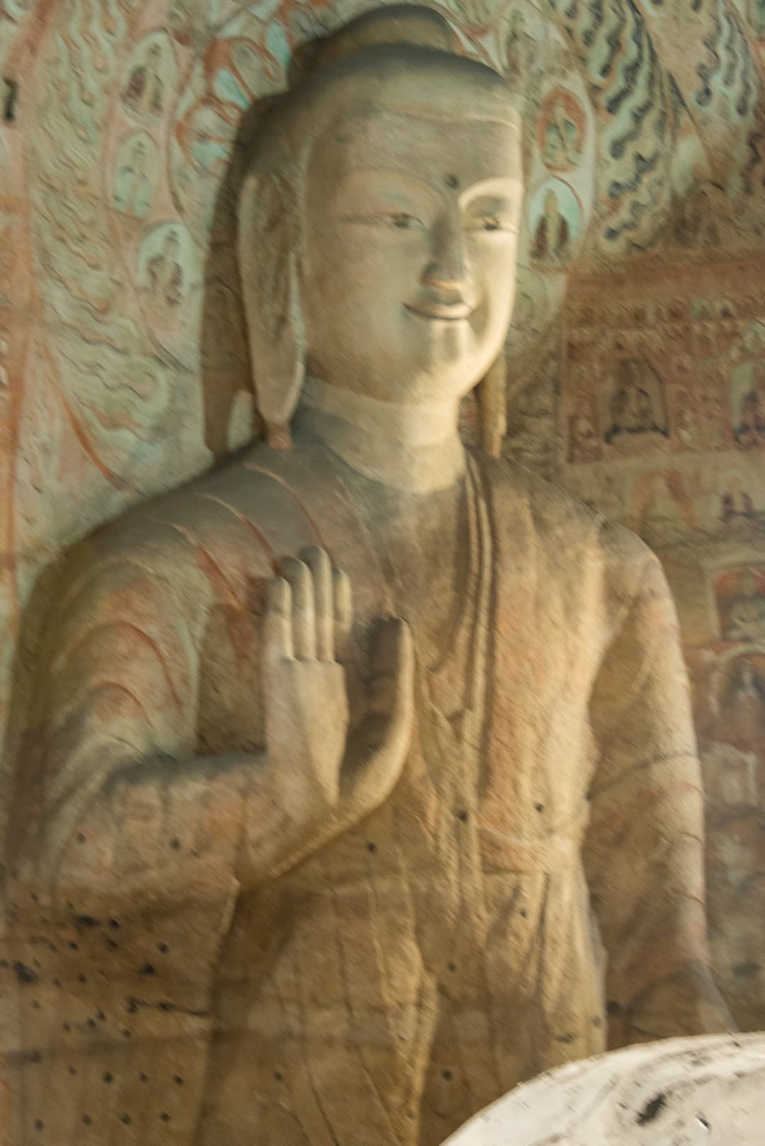 Interior view of a carved Buddha statue at Yungang Grottoes.