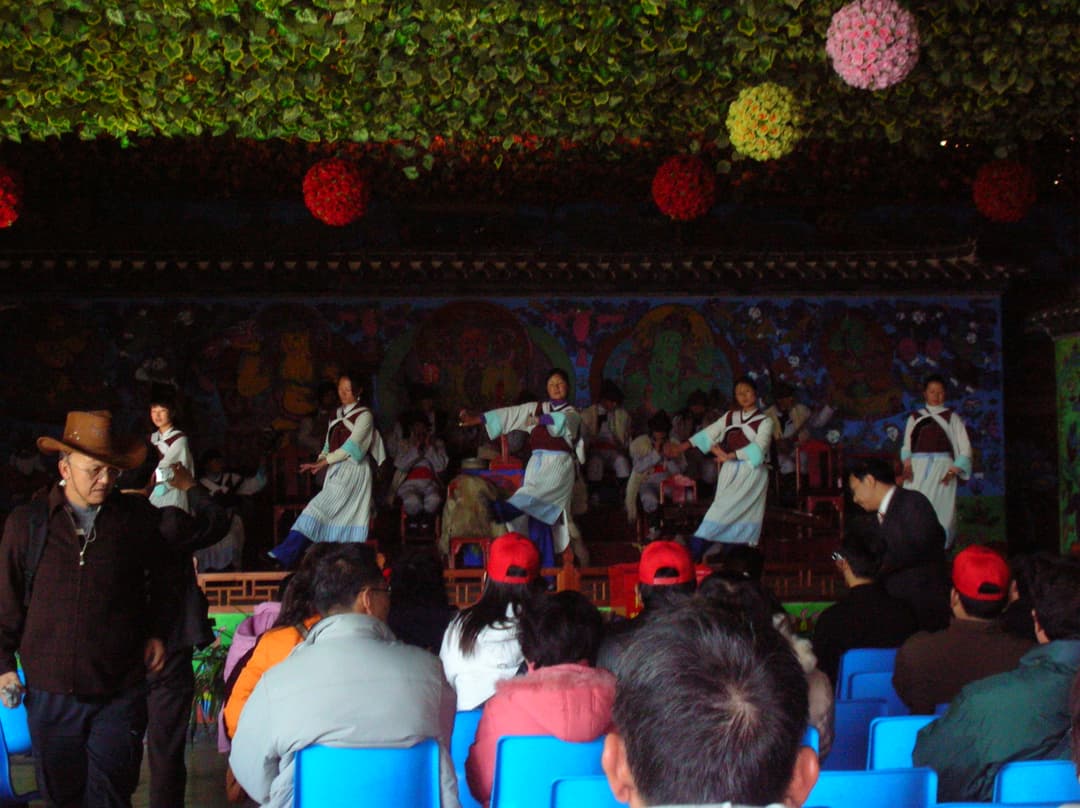 Interior view of a Naxi dance performance at Jade Water Village.