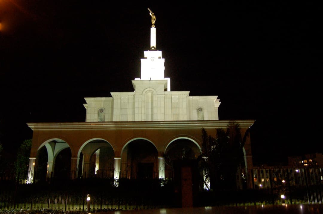 Exterior view of the Bogotá Colombia Temple surrounded by lush greenery.