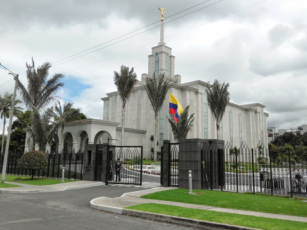 Bogotá Colombia Temple gated front entrance and spire on a cloudy day.