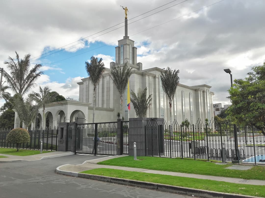 Angled daytime view of the Bogotá Colombia Temple and gated entrance.