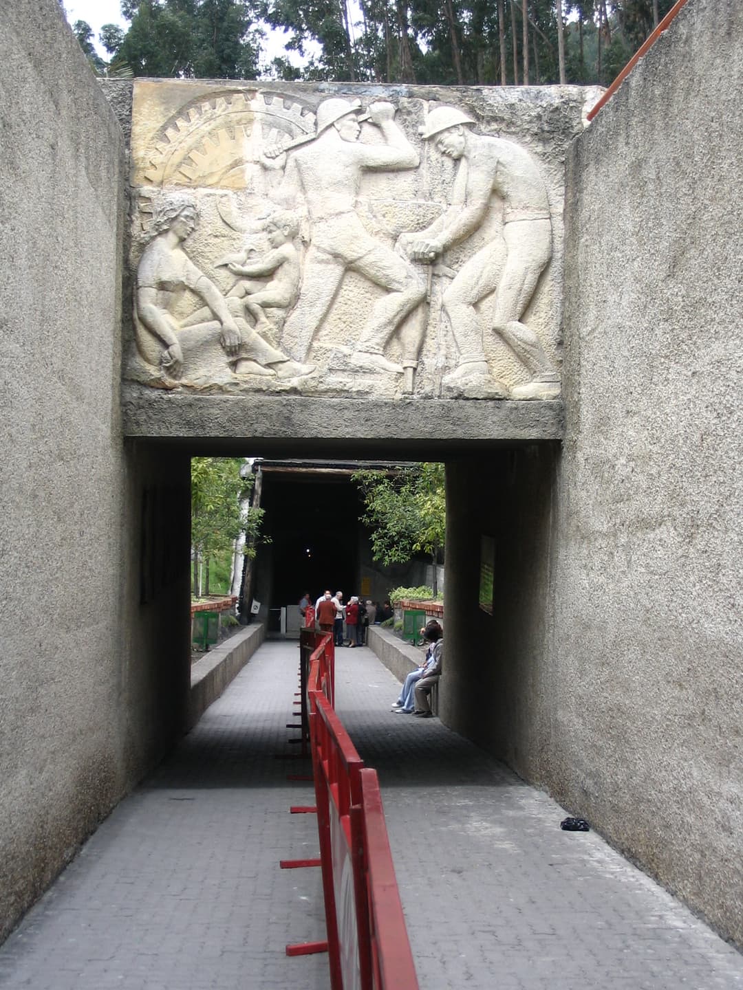 Bas-relief sculpture of miners above the entrance path to the Salt Cathedral
