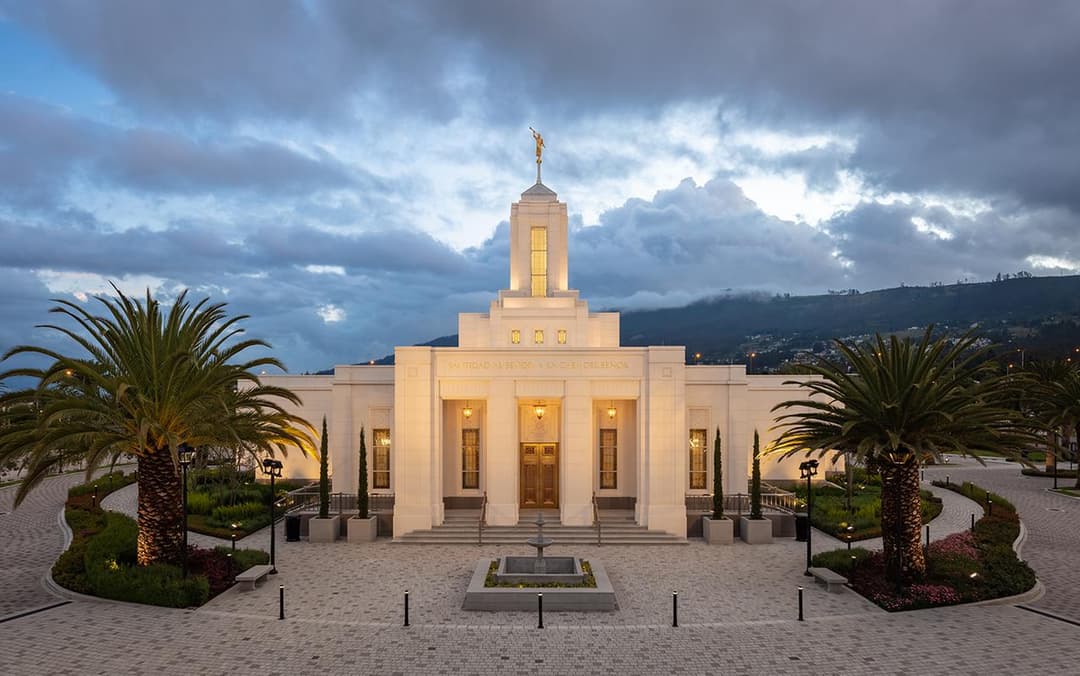 Front entrance of the Quito Ecuador Temple illuminated at twilight.