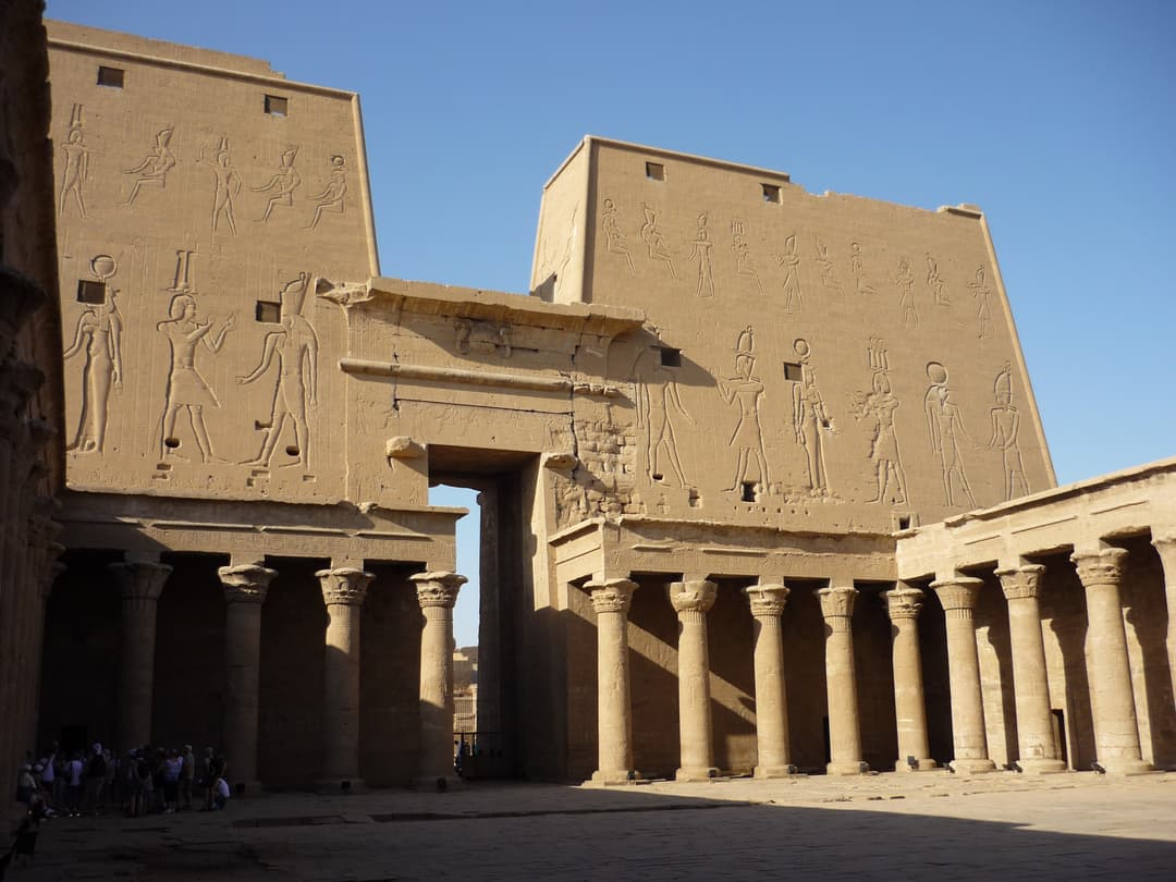 The imposing facade of the Temple of Edfu, showcasing its massive pylons.