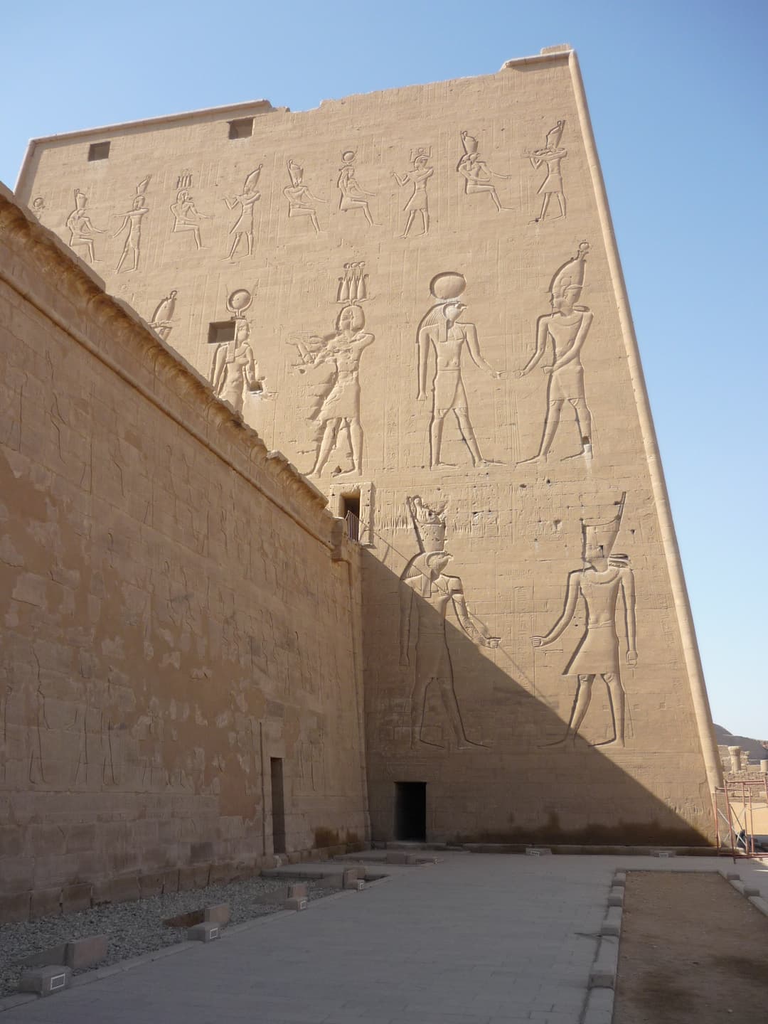 A statue of Horus as a falcon, guarding the entrance to the temple.