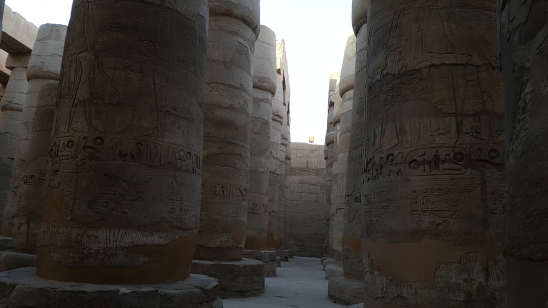 Massive columns with intricate carvings in the Great Hypostyle Hall.