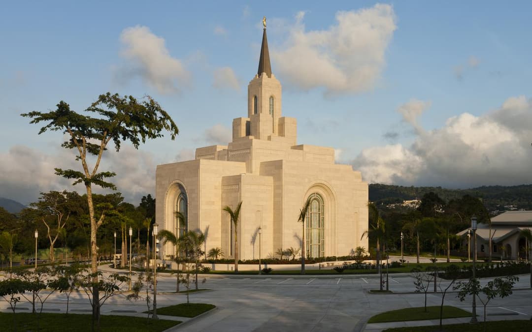 Wide exterior view of the San Salvador El Salvador Temple at golden hour.