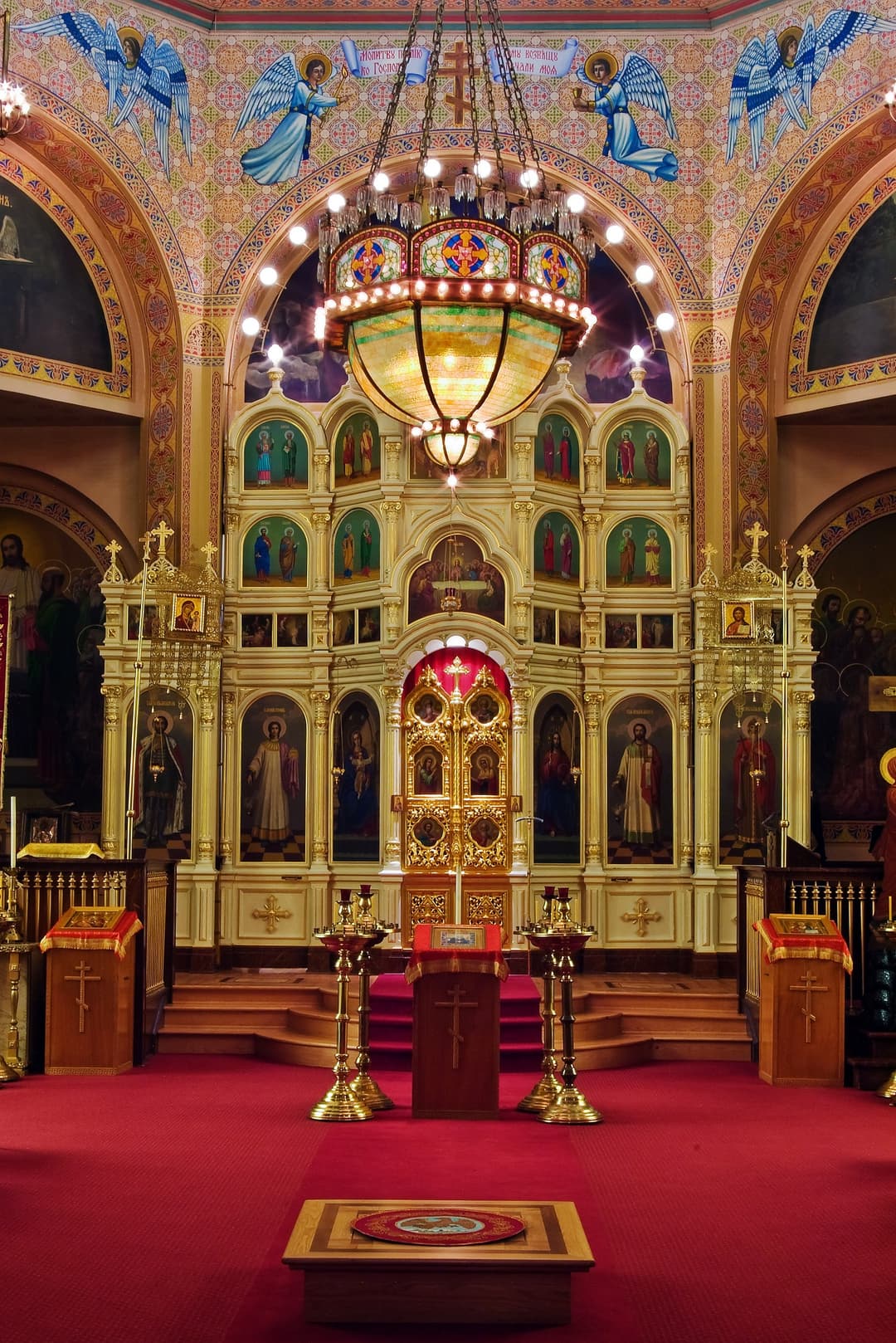 Holy Trinity Cathedral interior: iconostasis and ornate chandelier.