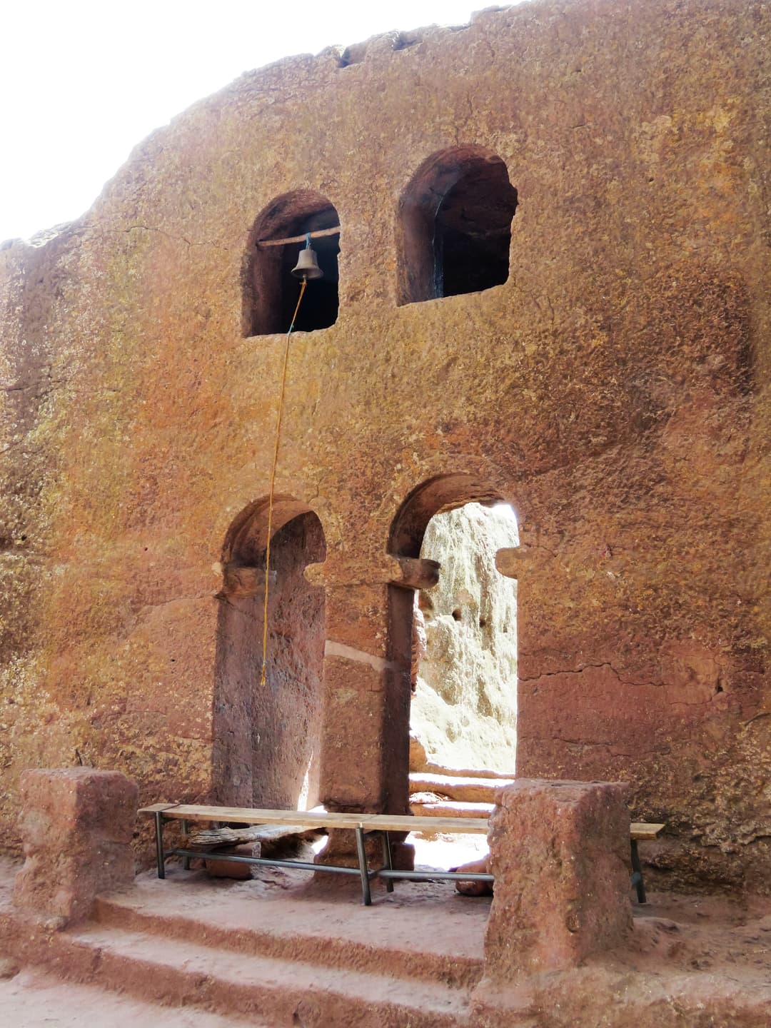 Arched rock-hewn entrance and upper bell window in Lalibela