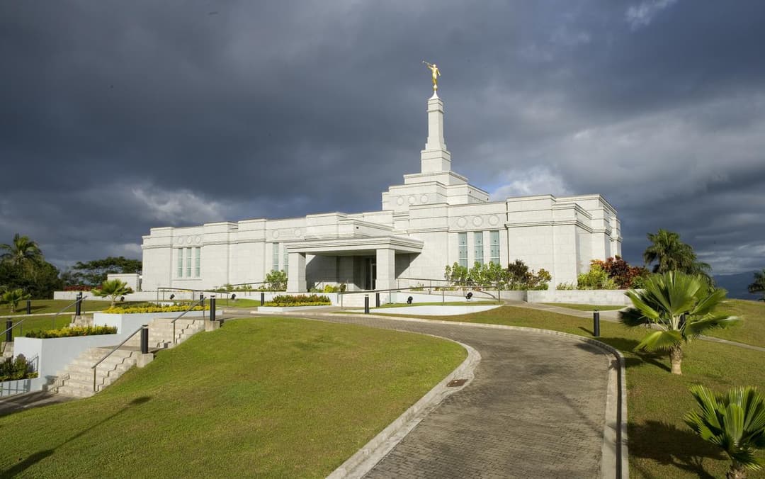 Wide-angle exterior view of the Suva Fiji Temple and its landscaped grounds.